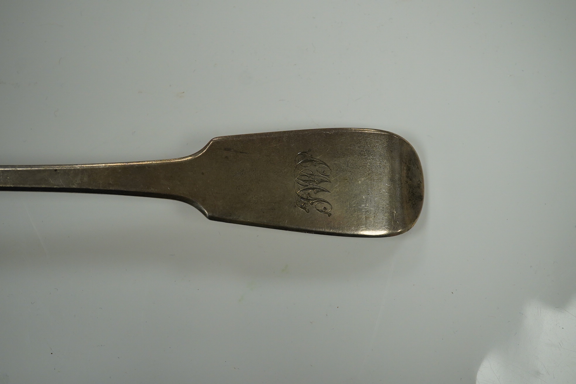 A George IV silver fiddle pattern basting spoon, London, 1829, 30.4cm, 158 grams. Condition - fair